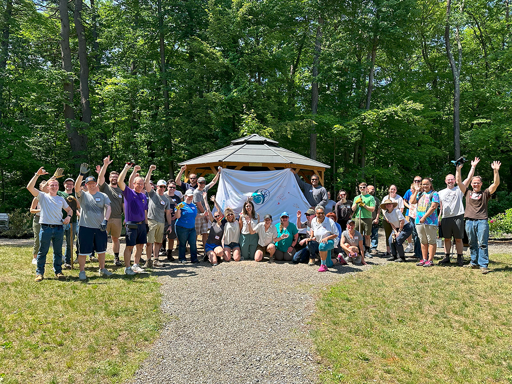 Volunteer group outside posing for camera